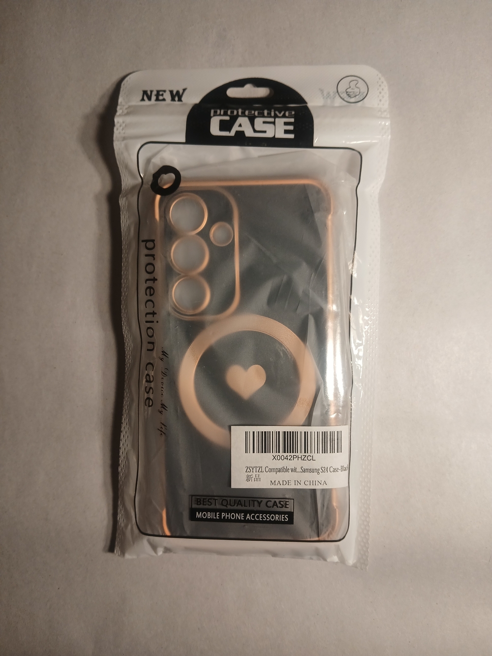 Protective Black Phone Case with Rose Gold Ring and a Heart Pattern